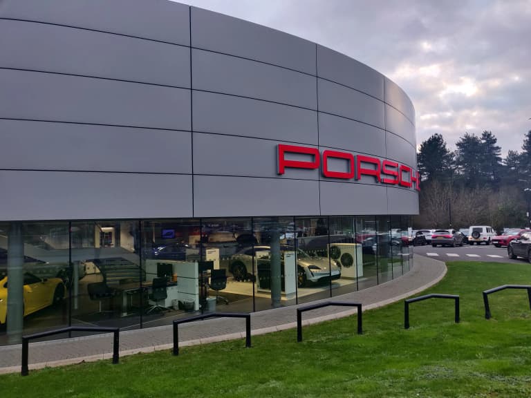 Porsche Centre showroom exterior with cars on display