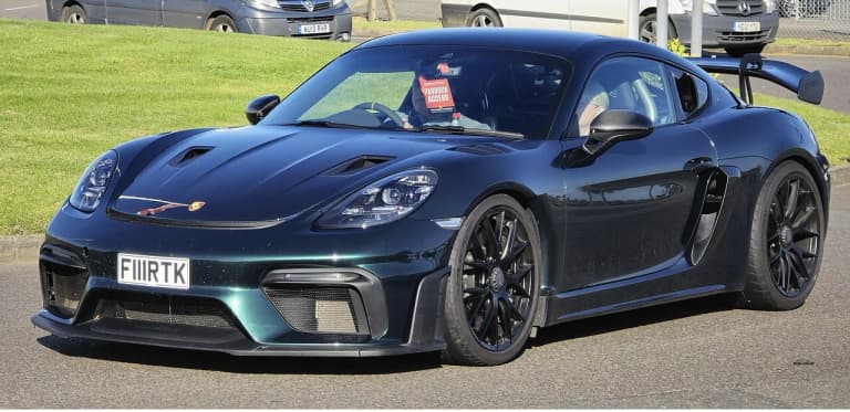 White Porsche 718 Cayman GT4 RS front three-quarter view
