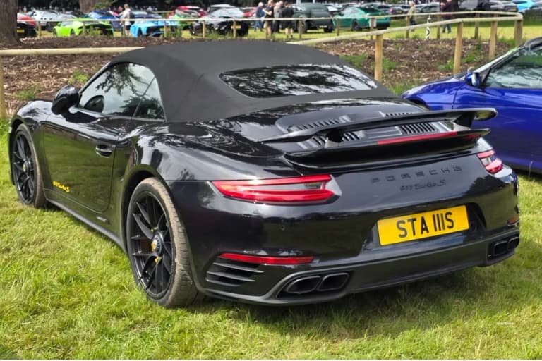 Gray Porsche 991 Turbo S Cabriolet on the road