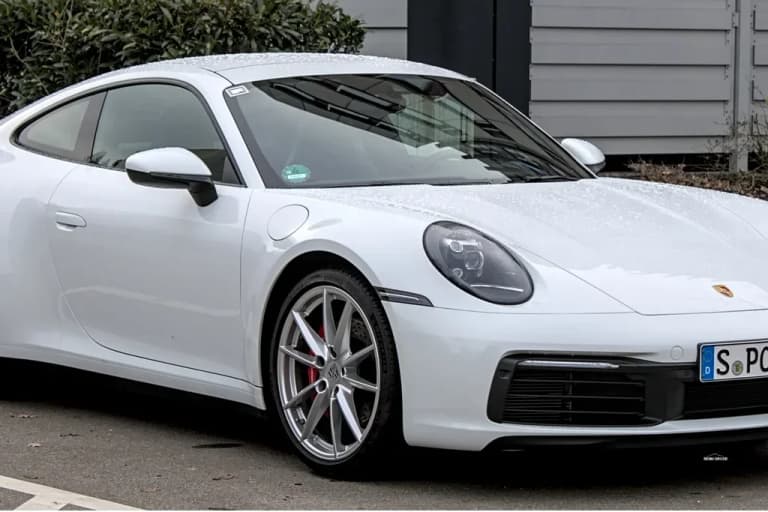 White Porsche 992 Carrera S from the front three quarter angle