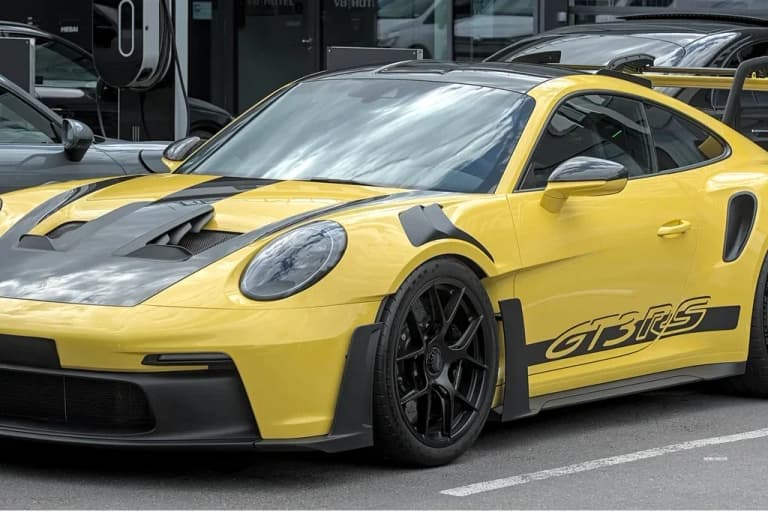 White Porsche 992 GT3 RS with rear wing on display