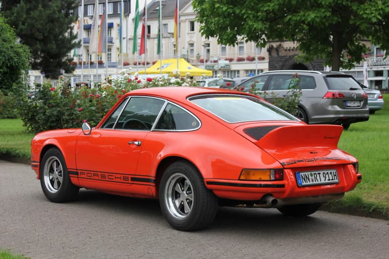 Orange Porsche 911 Carrera RS 2.7 with ducktail spoiler