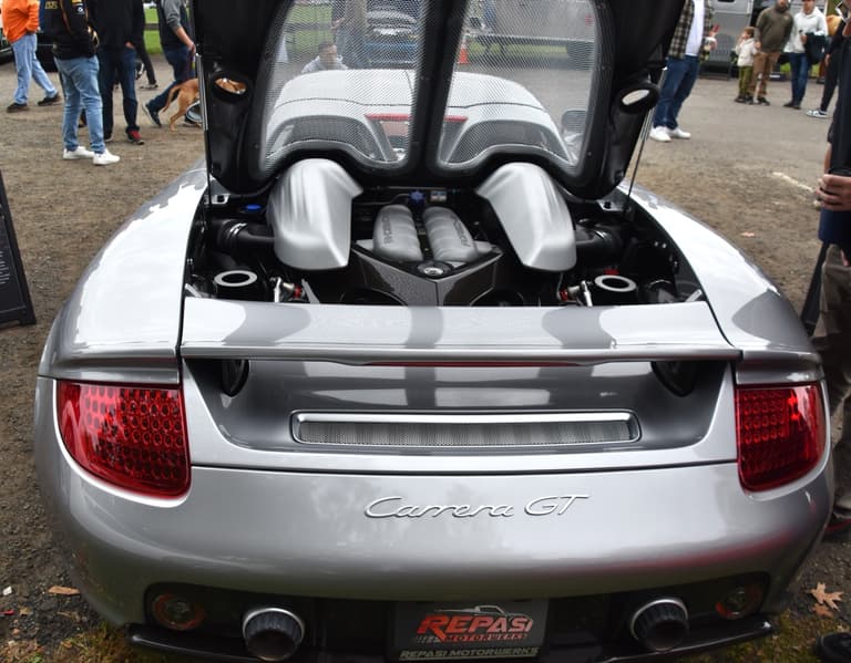 Open engine bay of a Porsche Carrera GT showing the 5.7 litre V10