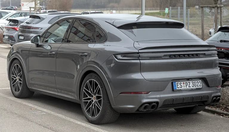 Dark grey facelift Porsche Cayenne GTS Coupe, rear three-quarter view