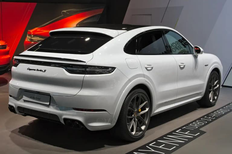 White Porsche Cayenne Turbo S E-Hybrid Coupe, rear three-quarter view