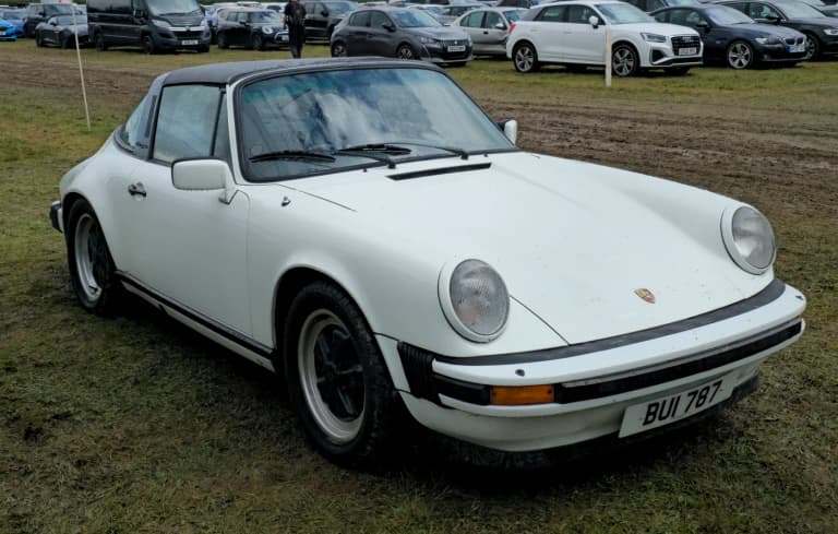 White Porsche 911 SC Targa with stainless steel Targa bar