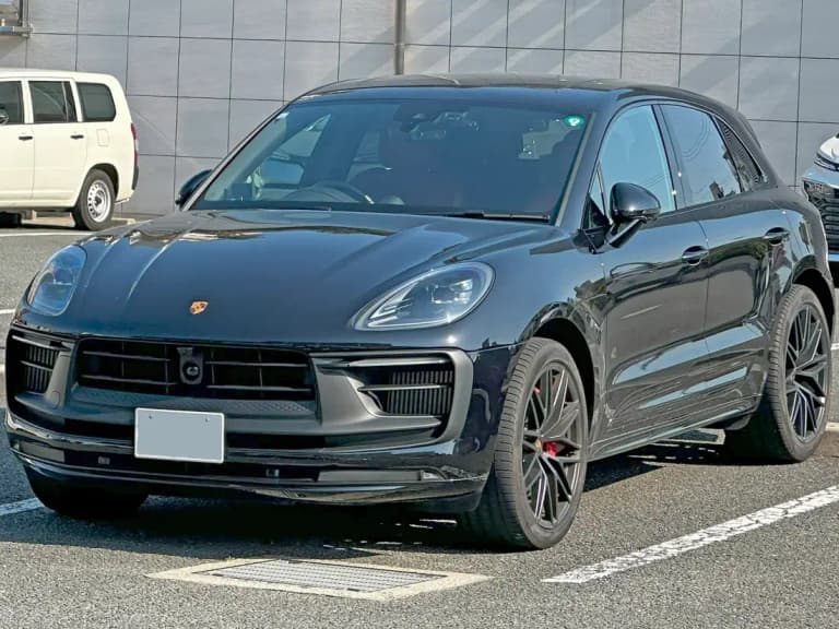 Black Porsche Macan GTS front view with darkened grille and trim