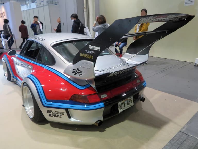 Martini-liveried RWB Porsche 993 with large rear wing at Osaka Auto Messe in Japan
