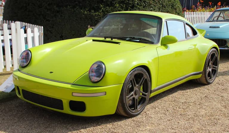 Lime green RUF SCR with round retro-style headlights and modern wheels