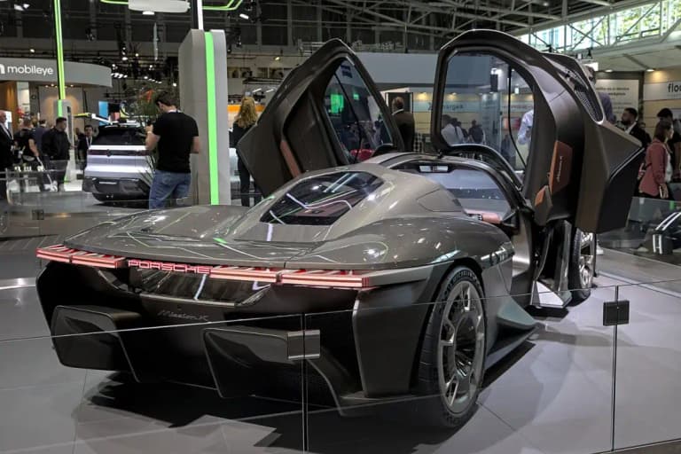 Porsche Mission X with both Le Mans style doors open, rear three-quarter view
