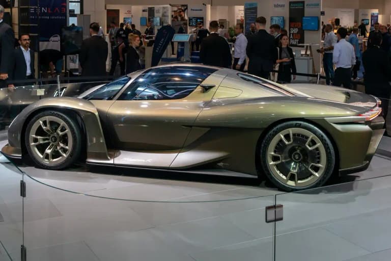 Porsche Mission X concept car in full side profile, showing the low roofline and large wheels