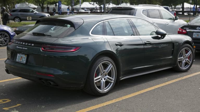 Dark green 2018 Porsche Panamera Turbo Sport Turismo, seen from the rear.