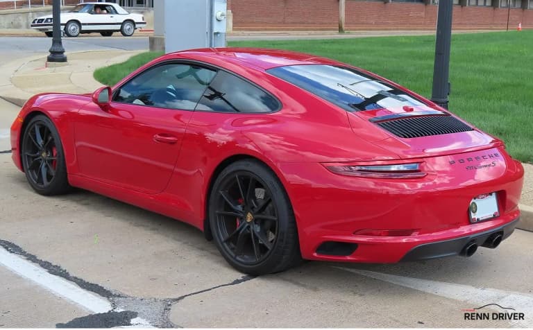 Red Porsche 991 generation 911 Carrera 4S, rear three-quarter view