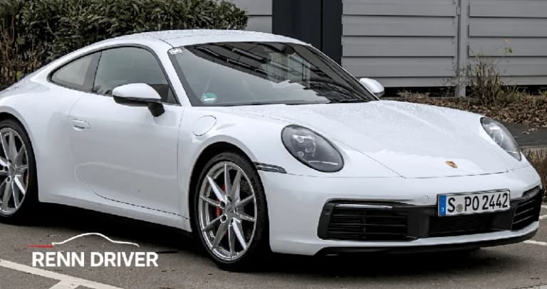 White Porsche 992 generation 911 Carrera S, front three-quarter street view