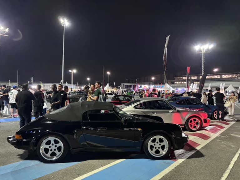 Cars and attendees at the Das Treffen Porsche gathering in Bangkok
