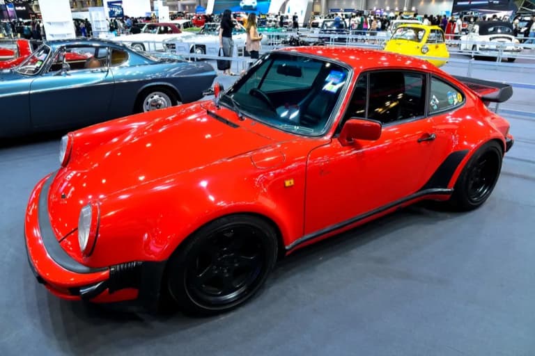 Red Porsche 911 displayed at the Thailand International Motor Expo