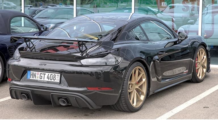 Yellow Porsche 718 Cayman GT4 front three-quarter view