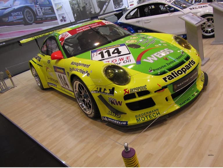 Porsche 997 GT3 R Hybrid in white and orange livery