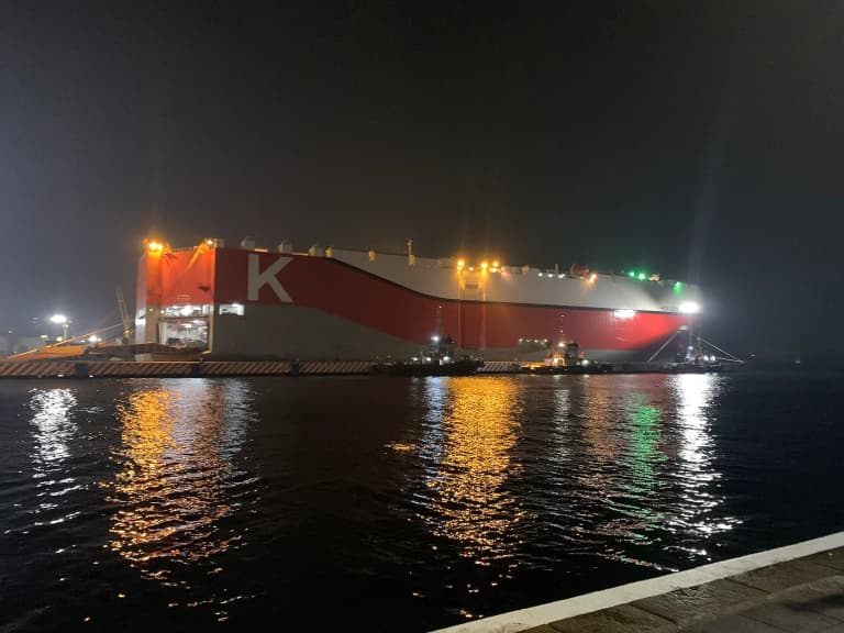 Roll-on roll-off car carrier ship docked at a port