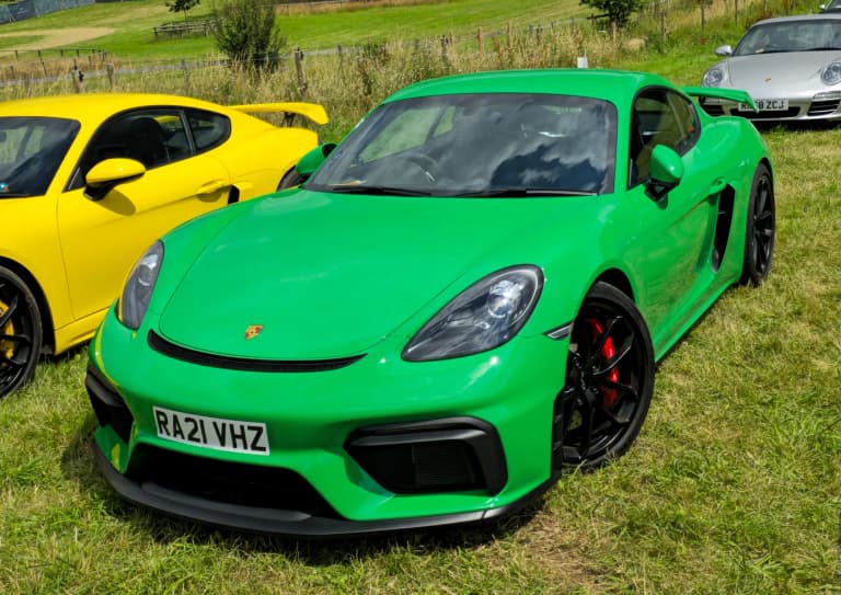 Porsche 718 Cayman GT4 in white at a show