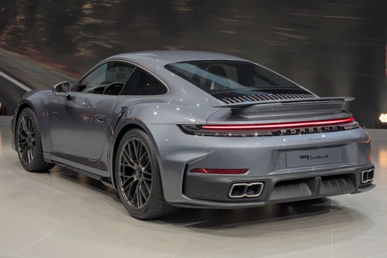 Two Porsche 992 Turbo S coupes at IAA 2025 in Slate Grey