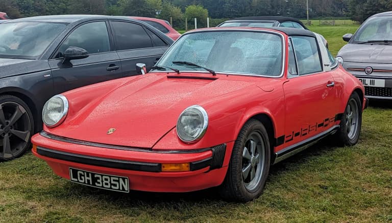 Red 1975 Porsche 911 2.7 Targa (G-body) with impact bumpers