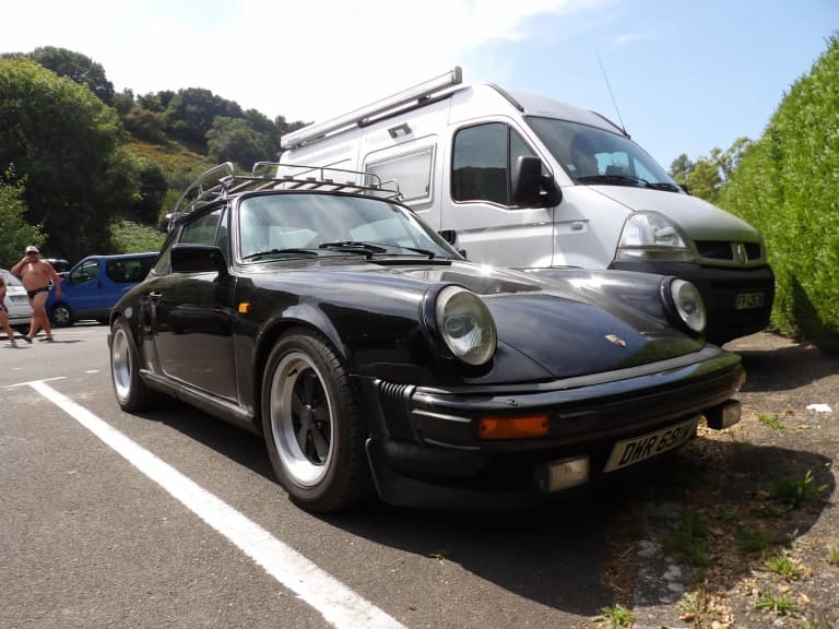 Black Porsche 911 SC Targa with Fuchs wheels