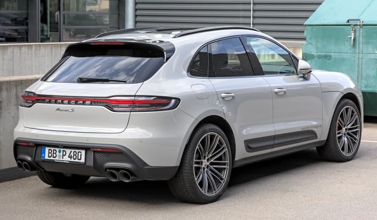 Grey 2022 Porsche Macan S parked outdoors at Motorworld Region Stuttgart