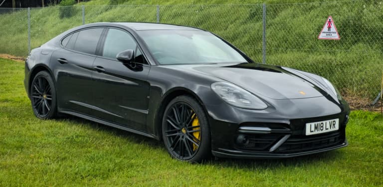 Dark gray second-generation Porsche Panamera 971 Turbo S at a car show