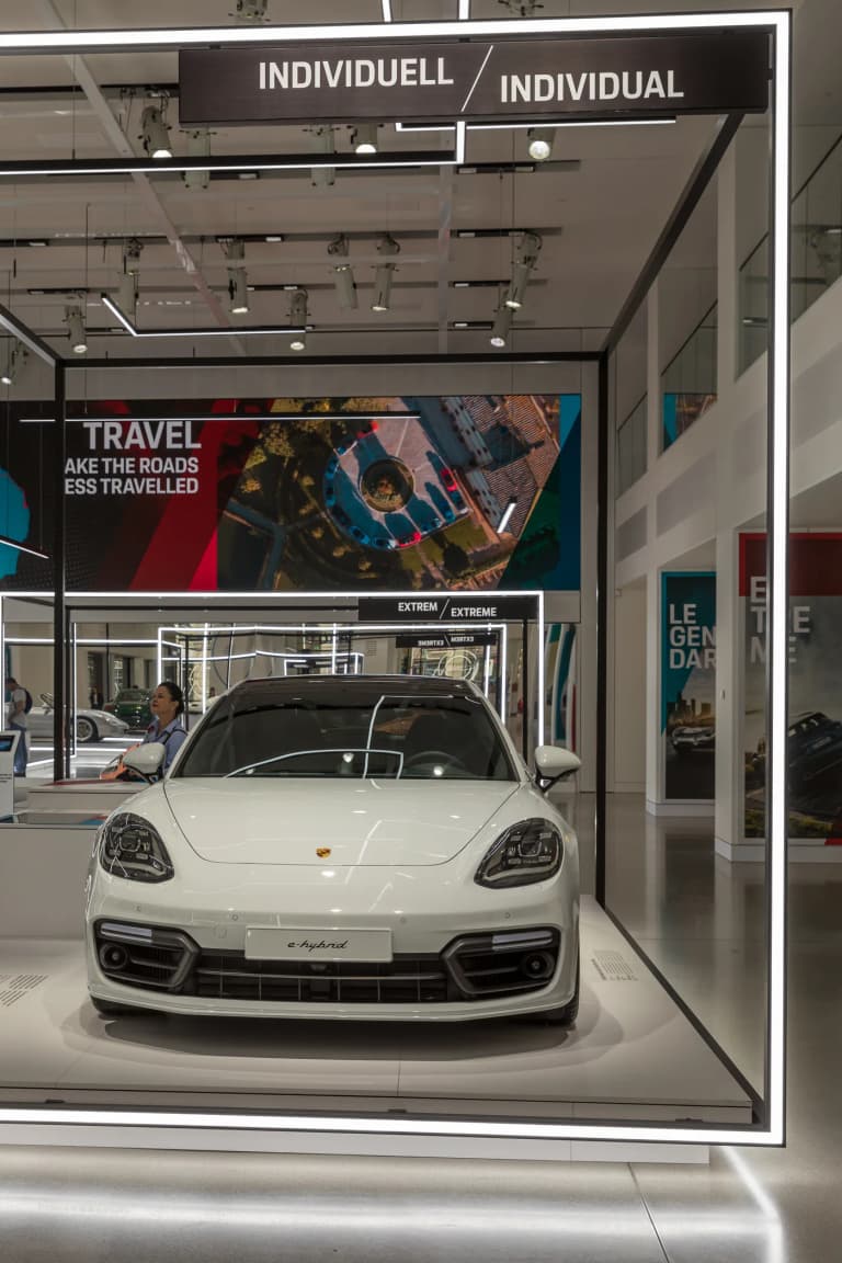 White second-generation Porsche Panamera E-Hybrid on display at the Porsche museum in Berlin