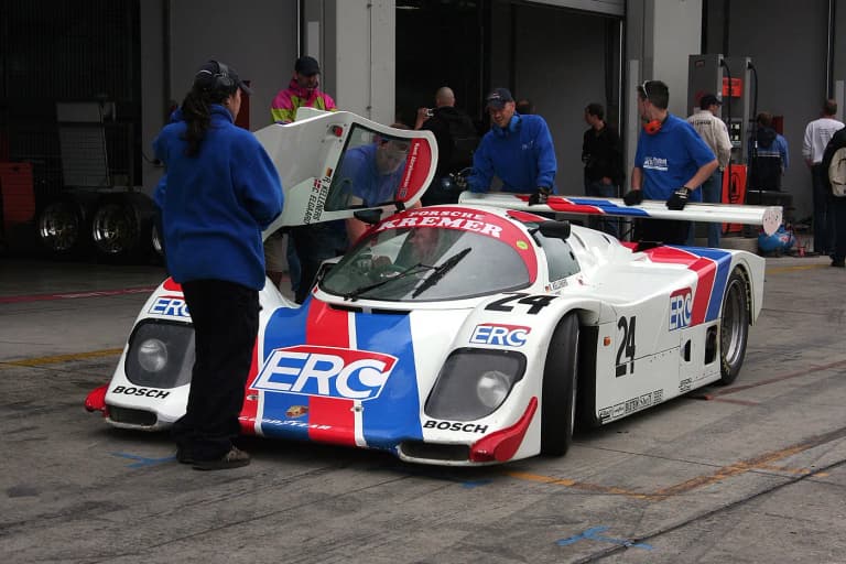 Porsche 962C Group C race car in the pit lane
