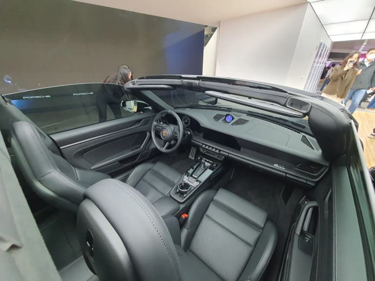 Modern Porsche 992 911 interior with digital instrument cluster and dashboard display