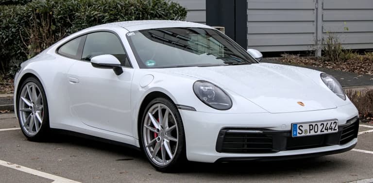 White Porsche 992 911 Carrera S parked, front three-quarter view