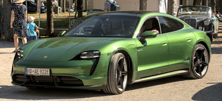Green Porsche Taycan Turbo sedan, three-quarter view