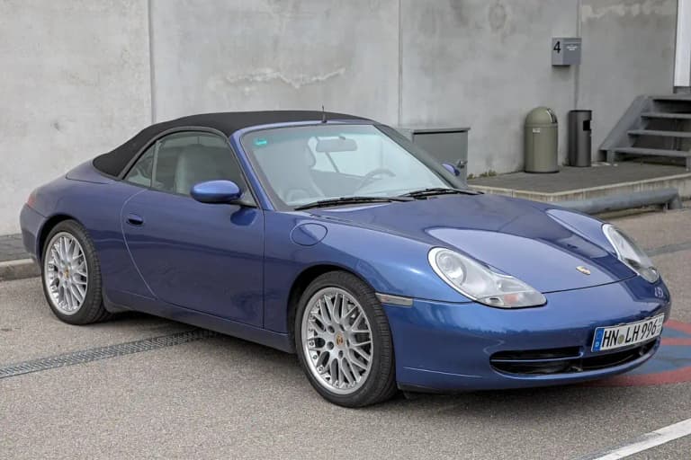 Blue Porsche 996 911 Carrera cabriolet with roof up, front three-quarter view