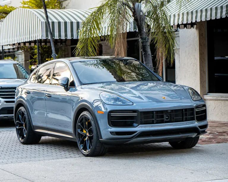 Arctic gray Porsche Cayenne Turbo GT, front three-quarter view with black wheels