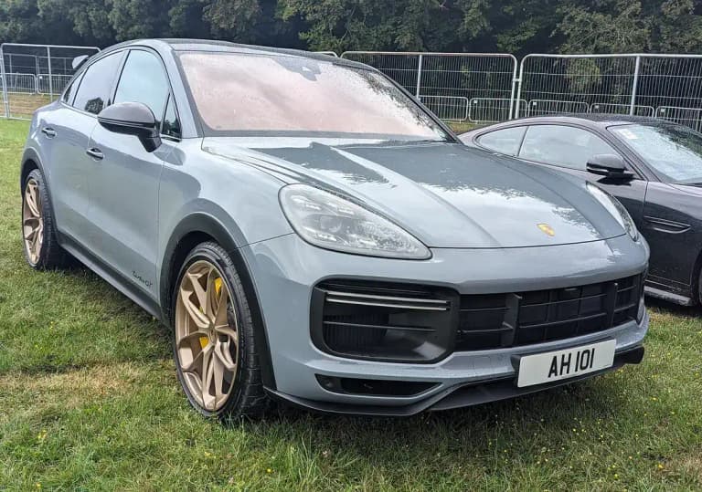 Gray Porsche Cayenne Turbo GT with bronze GT Design wheels, front three-quarter view