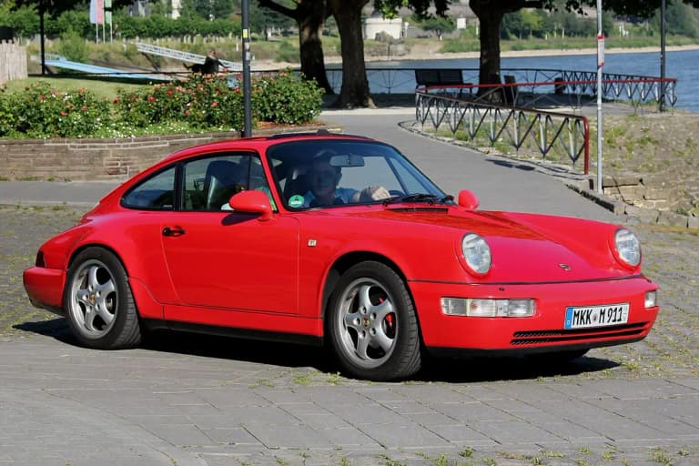 Red Porsche 911 (964) Carrera coupe from the air-cooled era