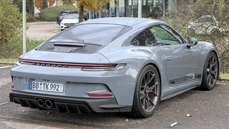 Grey Porsche 992 GT3 Touring, rear three-quarter view