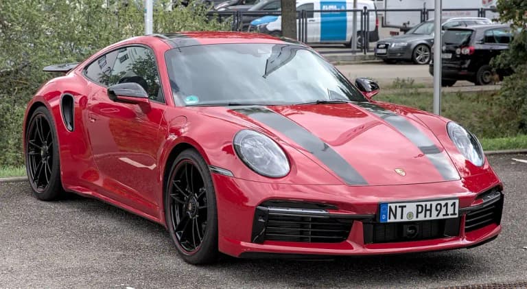 Red Porsche 992 Turbo S coupe, front three-quarter view