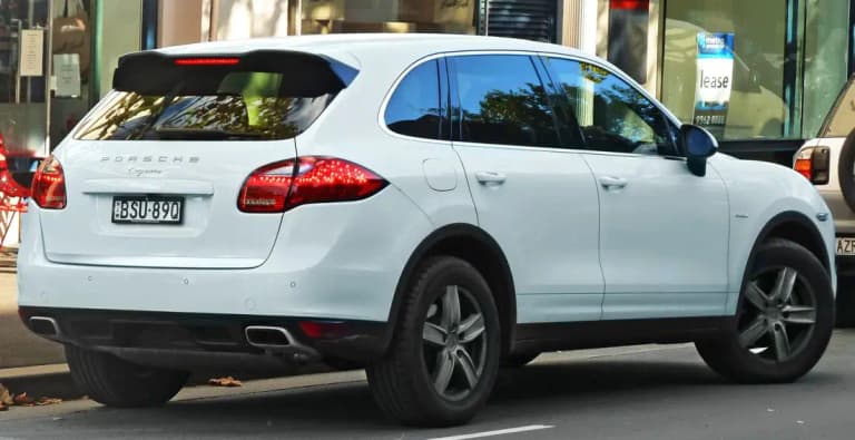 White Porsche Cayenne 92A Diesel, rear three quarter view showing the wagon body and Cayenne badge