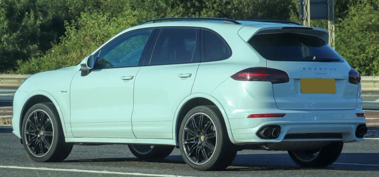 White Porsche Cayenne S Diesel, rear three quarter view showing the Cayenne S badge and diesel script on the fender