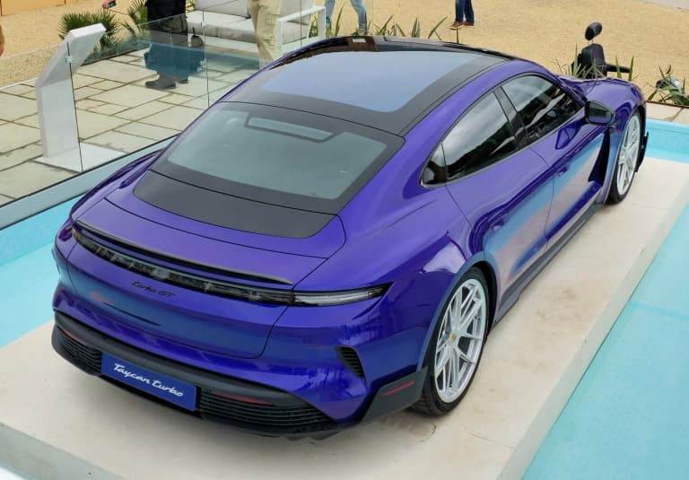 Purple Porsche Taycan Turbo GT viewed from the rear three-quarter angle