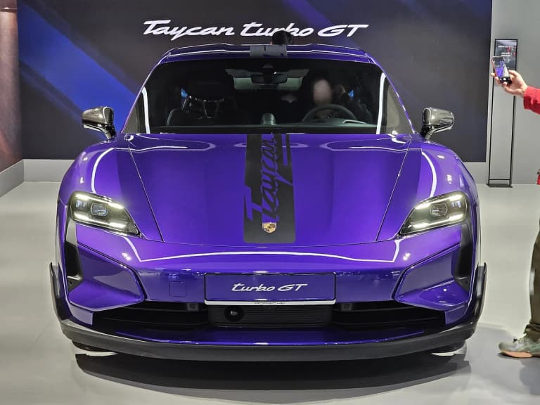 Purple Porsche Taycan Turbo GT with Weissach graphics viewed from the front