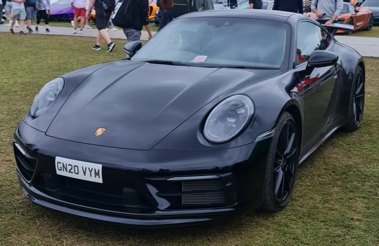 Black Porsche 992 911 Carrera 4S Coupe at the Goodwood Festival of Speed.