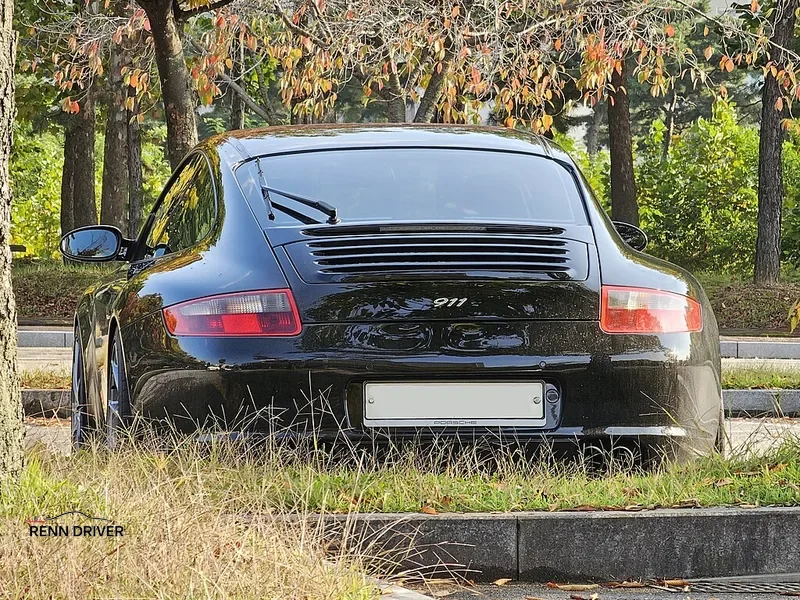 Black Porsche 997 rear three quarter view