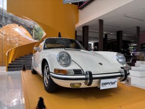 White Porsche 911E in Showroom