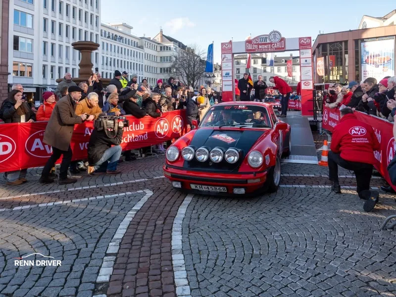 1978 Porsche 911 Turbo (930) in rally livery with rear whale-tail spoiler at a car event