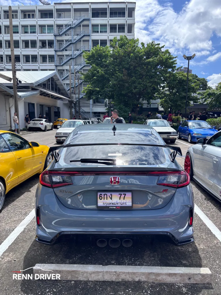 Rear view of grey FL5 Civic Type R with triple center exhaust.