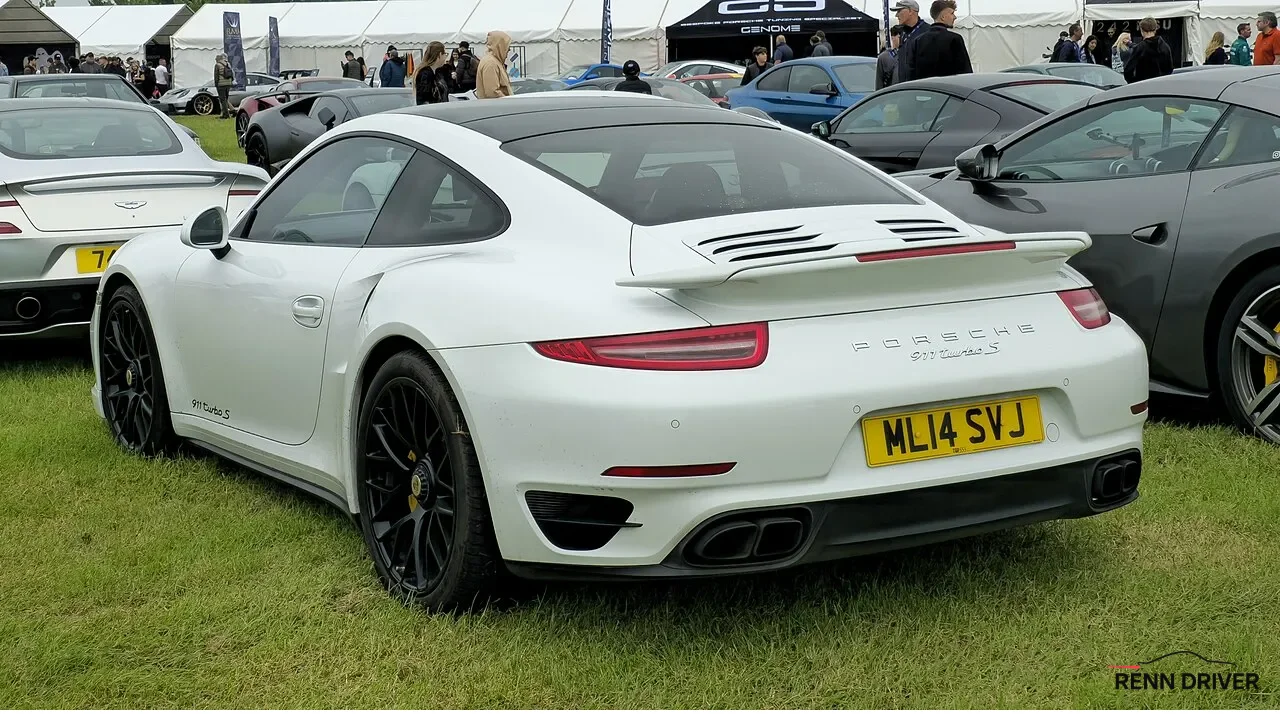 White Porsche 991 Turbo S from the rear at a car show